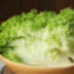Batavian lettuce in a wooden bowl.