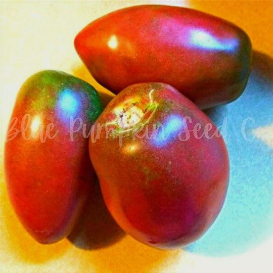 Thumbnail: Purple Russian tomatoes on a well lit counter top.