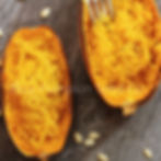 Spaghetti squash that has been baked and fluffed with a fork.