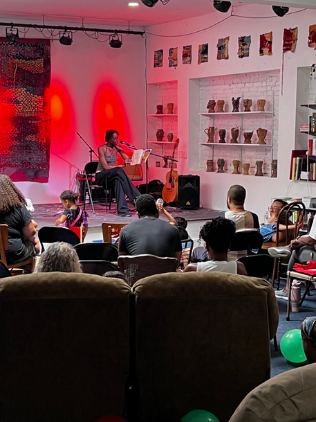 woman reading to an audience