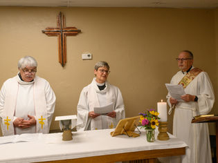 Three clergypersons lead a worship service at a small episcopal church in Harrah, Oklahoma.