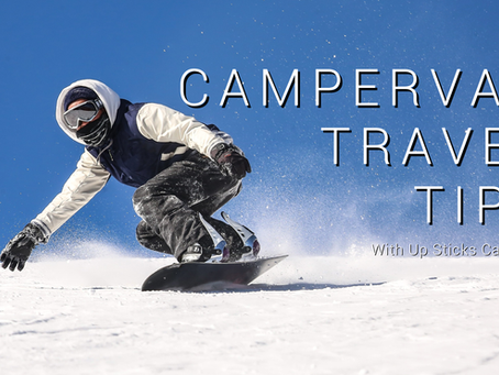 Someone snowboarding down on a clear blue sky day 