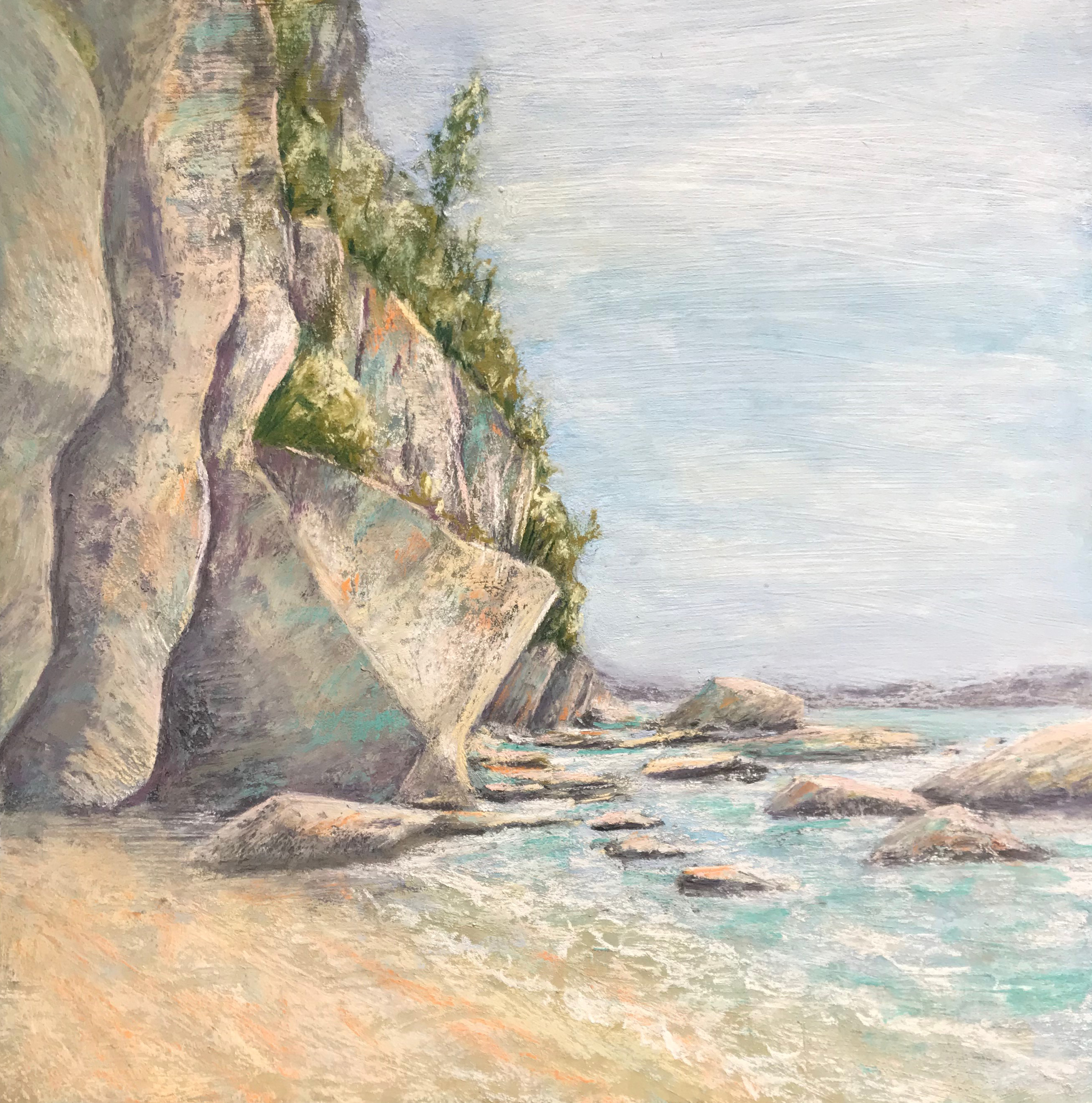 A rocky cliff lies at the breaker's edge