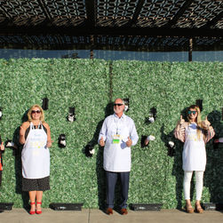 staff infront of the wine wall.jpeg