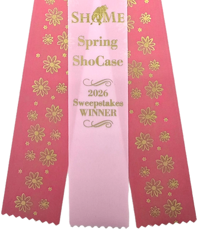 Pattern-printed award ribbon streamers with gold floral design and a center “Spring Showcase 2026 Sweepstakes Winner” printed