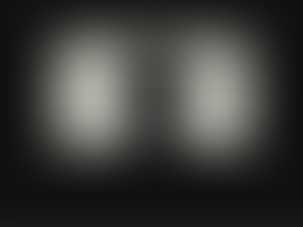 Silhouette of a person watching a TV with white static in a dark room, creating a tense, lonely mood.