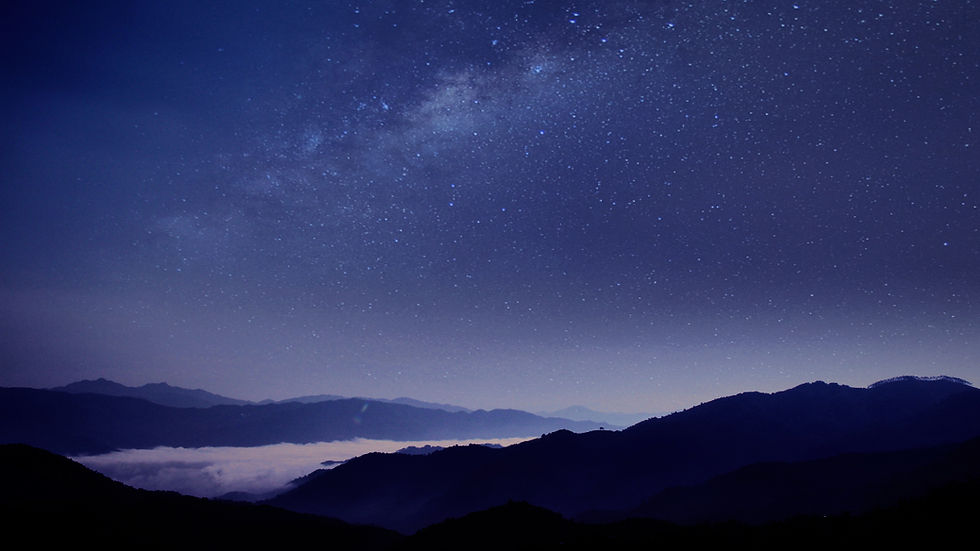 Snowy mountain peaks under a purple Milky Way sky with a bright meteor streaking overhead at dusk.