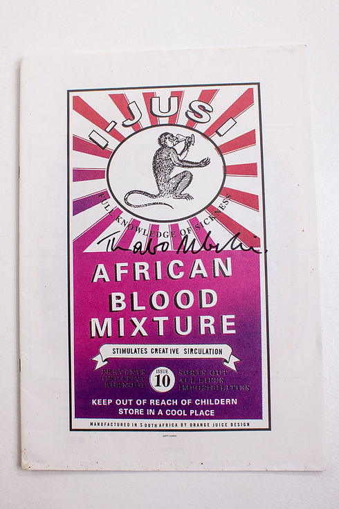Vintage advertisement with monkey logo, reading "i-JUSI African Blood Mixture" and signed by Thabo Mbeki.