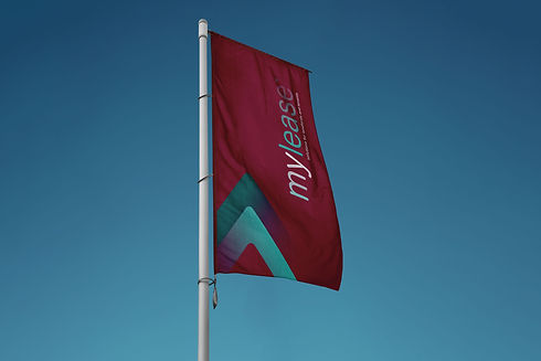 Red flag with "mylease" text and colorful logo against a blue sky.