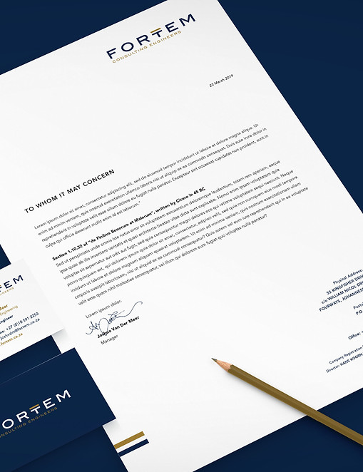 FORTEM branding on stationery with pencil and business card on navy blue background