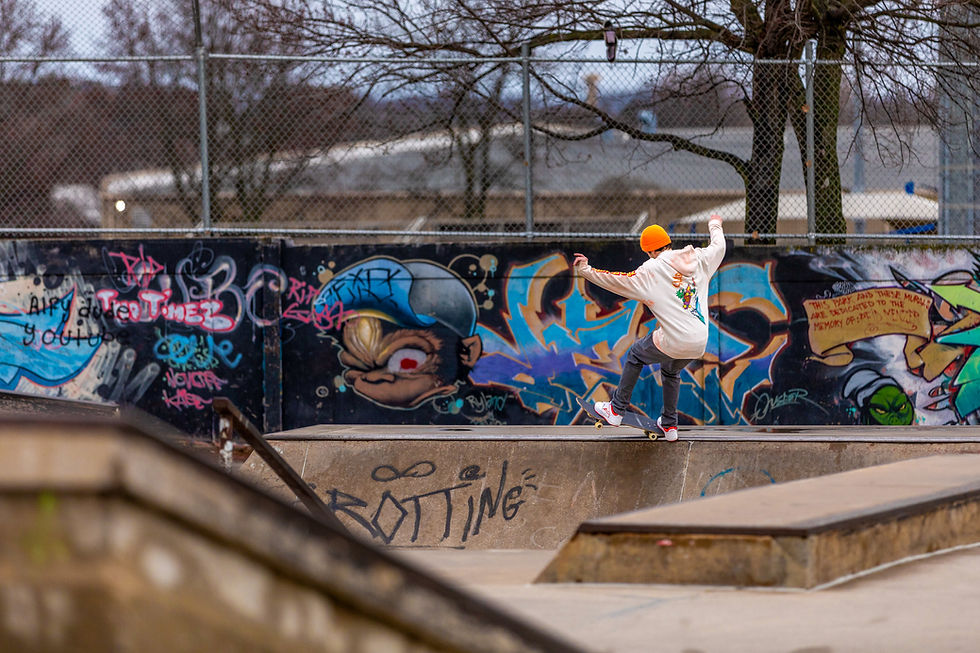 A picture of myself skateboarding at Reid Menzer in York, PA. The trick is a frontside grind.