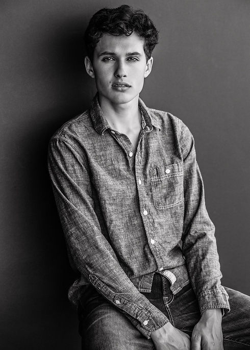 A picture of myself modeling a denim shirt, was originally a headshot I used to book jobs.