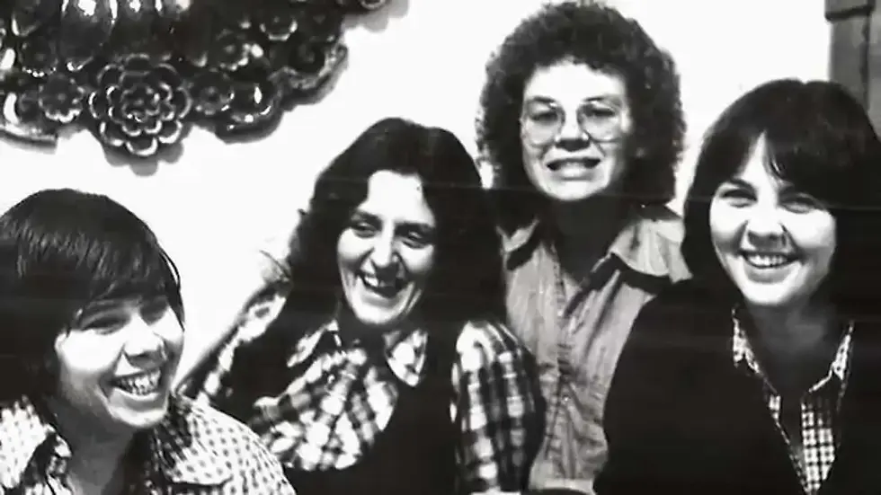 Black and white photograph of Adrienne Potts, Pat Murphy, Sue Wells, and Heather (Beyer) Elizabeth