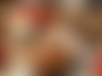 Rustic wooden table setting featuring a bowl of authentic Bucatini all'Amatriciana, surrounded by fresh San Marzano tomatoes, Pecorino Romano cheese, red wine, and a package of Fortunato Salumi Guanciale.