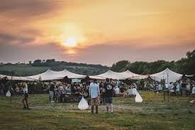 These hills beer festival tents with peaks and hundreds of people watching the sun go down. 