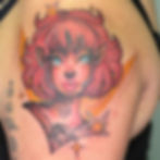 Colorful illustrative tattoo by Draven Toews of a fantasy-inspired girl with red hair, elf-like features, and cosmic star accents.