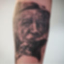 Black and grey realism portrait tattoo with detailed facial texture at Albert Street Tattoo