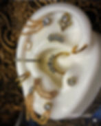 Luxury ear piercing jewelry curation featuring gold rings, chains, and gemstone accents