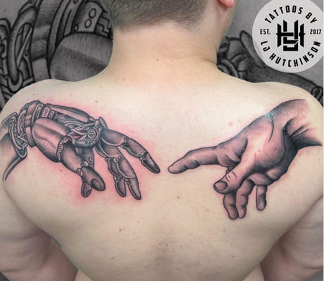 Back tattoo of robotic hand reaching toward human hand in black and grey realism.