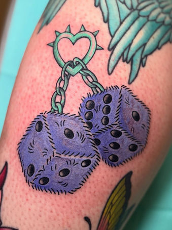 Purple fuzzy dice tattoo hanging from a mint heart chain, colorful and cartoon-style by Katie Moon.