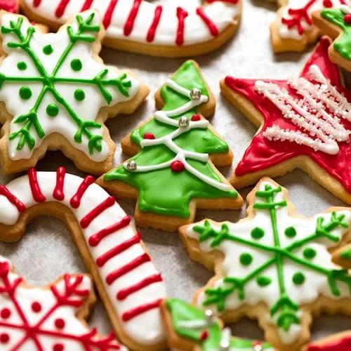 Decorated Christmas cookies in festive shapes and colors, used as a metaphor for lightwork and the importance of clear ingredients and intention.