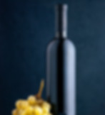 front-view-bottle-wine-with-fresh-grapes-dark-background-fruit-drink-alcohol-color-photo.j