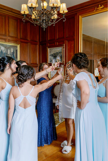 The bridal party having a toast before the ceremony.