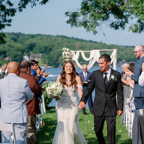 A bride and groom walking back down the aisle after getting married.