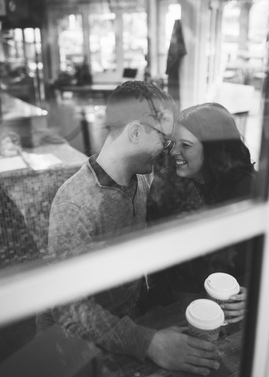 Man and woman embracing in coffee shop