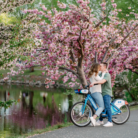 Man and woman kissing on blue bicycle