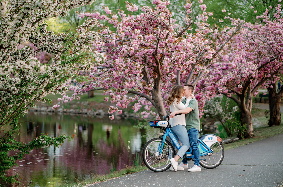 Man and woman kissing on blue bike