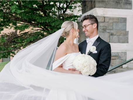 Bride and groom smiling at each other
