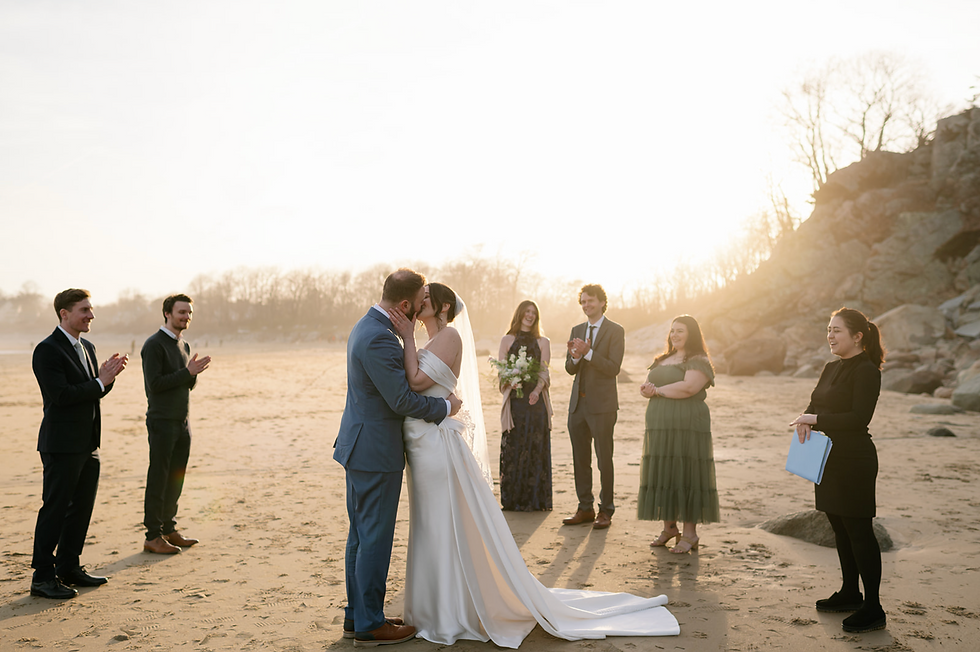 bride and groom kissing after saying "I do"