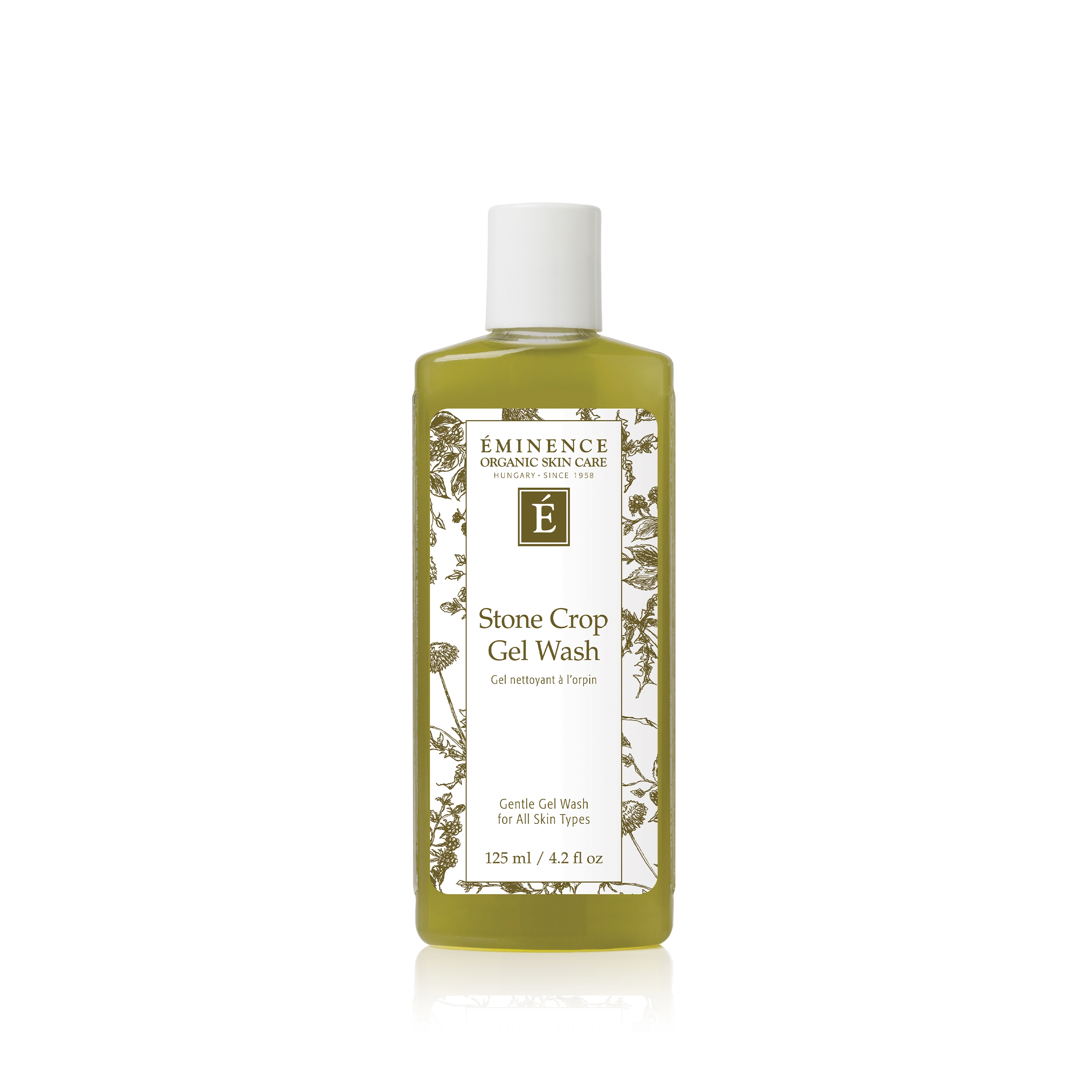 Spa product arrangement with flowers and towels, bright airy flat lay