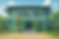 Teal Colonial Retreat Amidst Greenery.png
