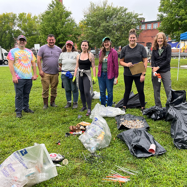 group standing behind trash they collected