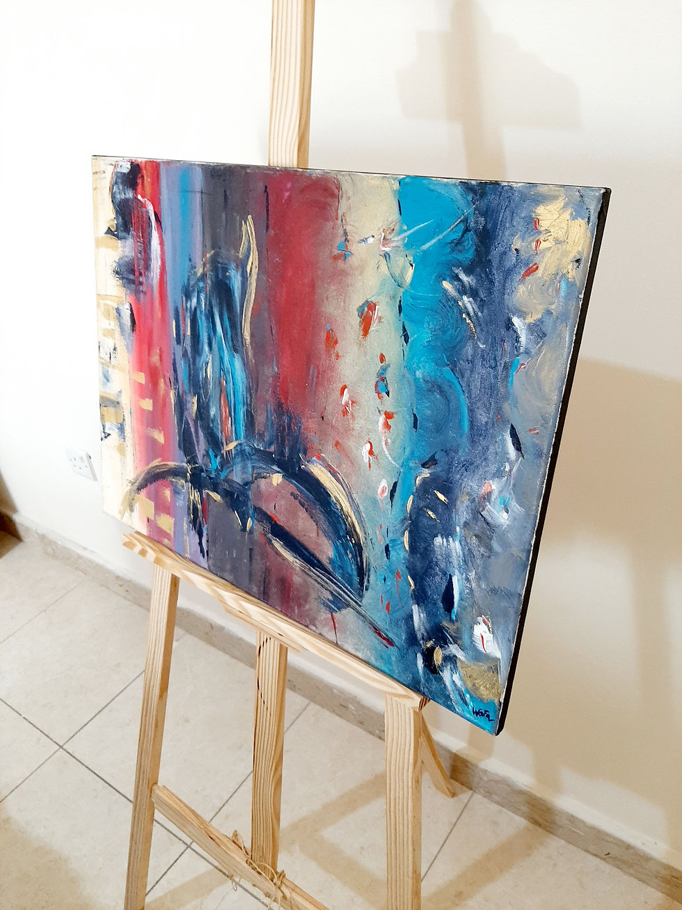 Thumbnail: Abstract art with red, blue, and gold colors on wooden easel background.