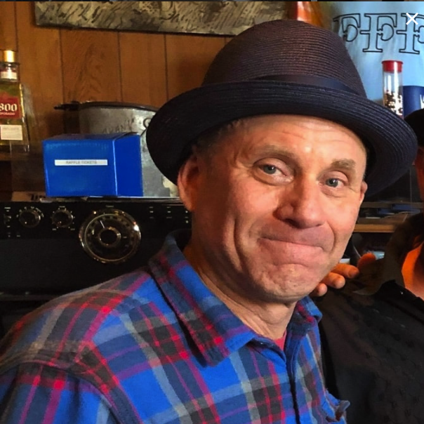 Male, Phil Bayer, is a guitar instructor at Friendly School of Music.