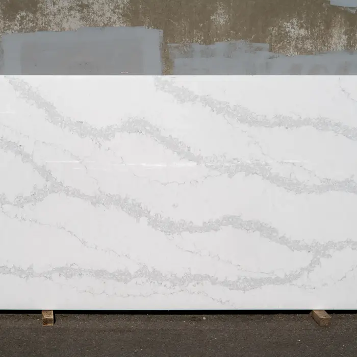 Large white countertop with grey veining displayed against a neutral background.