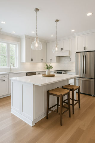 Modern white kitchen with island, stainless steel appliances, and wood stools.