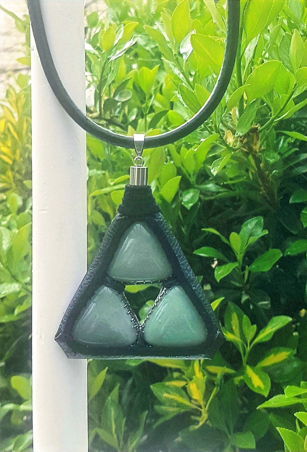3" pendant with 3 green aventurine triangles wrapped in leather.  - 24" leather necklace with stainless steel lobster clasp