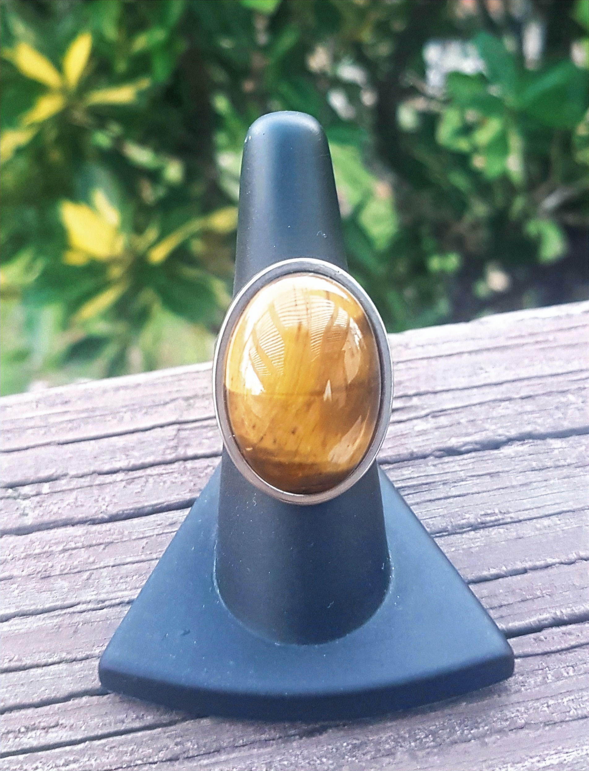 Oval Tiger Eye gemstone, adjustable stainless steel ring (size 6 - 8).
