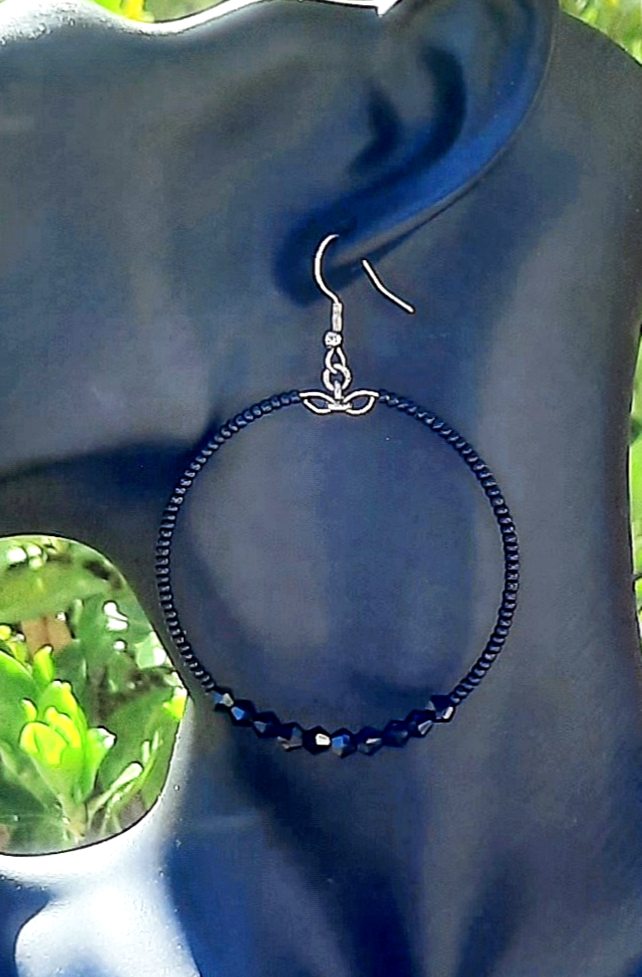 Thumbnail: Black seed bead hoop earring with black crystals and stainless steel ear hooks.