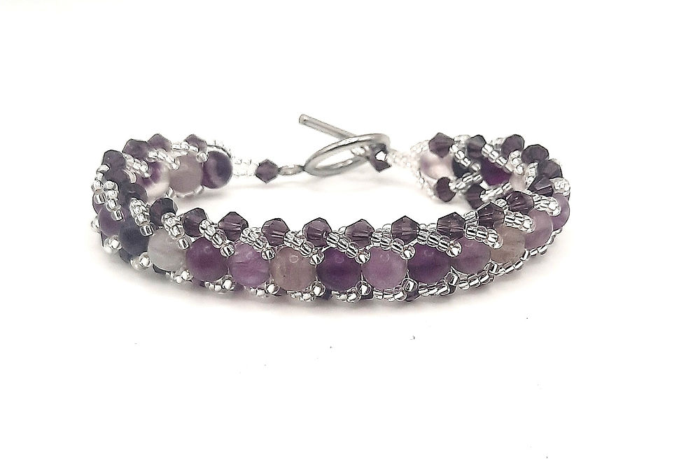Thumbnail: 7" handstitched flat spiral bracelet created with silver lined crystal seed beads, Amethyst gemstones and crystals.
