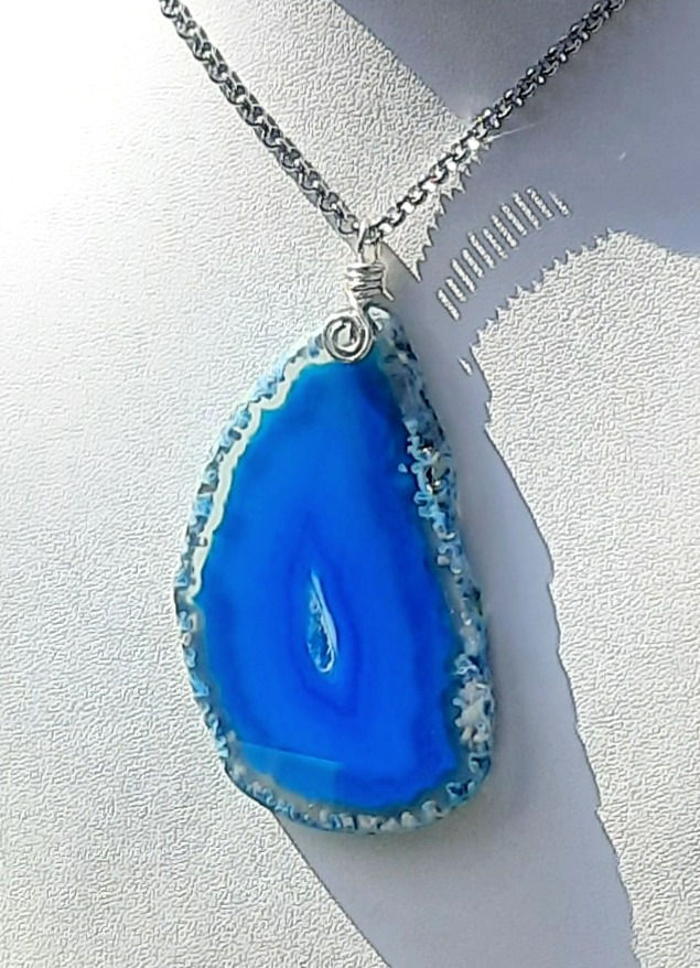 Thumbnail: Necklace with sliced agate quartz pendant and hand wrapped silver spiral
