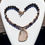 Thumbnail: Handmade necklace w/ Bronzite, Amber Fire Crackle Agate, glass beads; 2.5" sliced Agate Quartz pendant; gold toggle clasp.