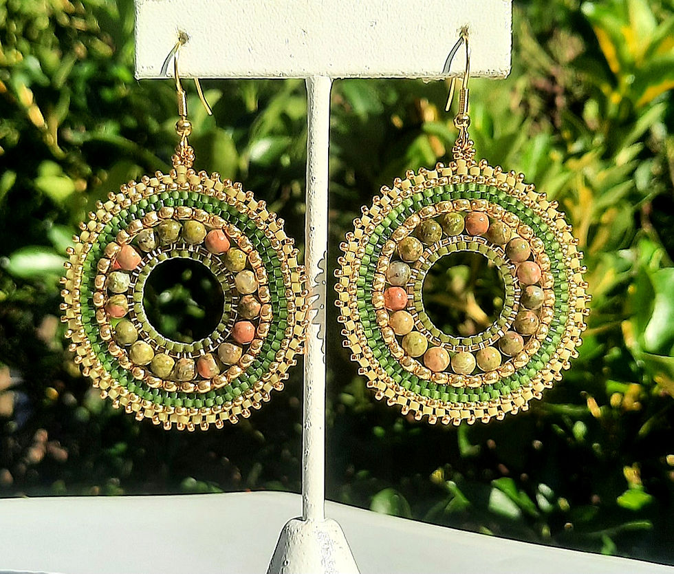 Hoop earrings with unakite gemstones; green and gold seed beads; and gold ear hooks.