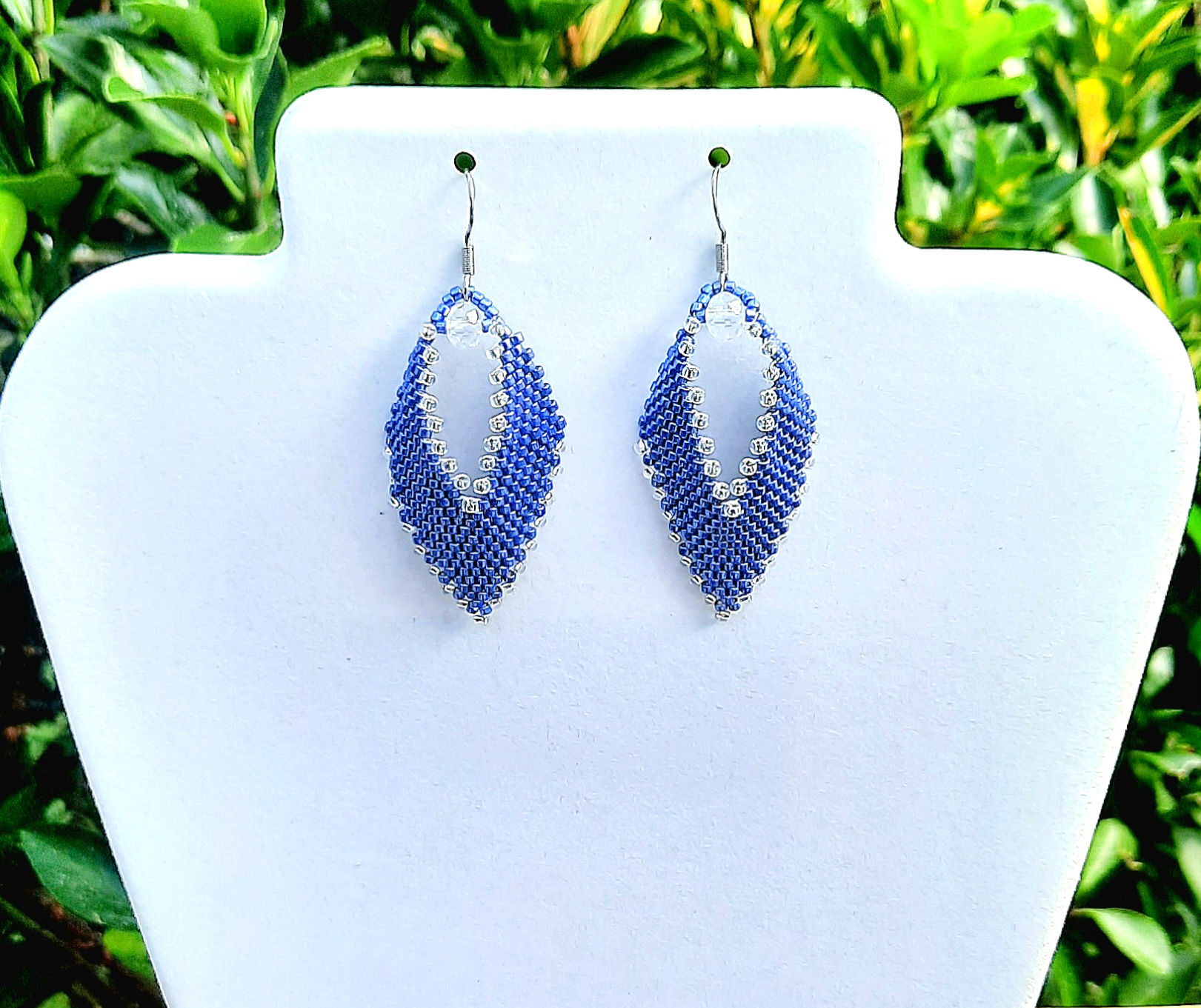Handstitched sapphire blue and crystal silver lined seed bead leaf shaped earrings.