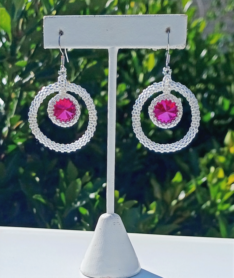 Thumbnail: crystal seed bead hoop earrings with a pink crystal hanging in the center