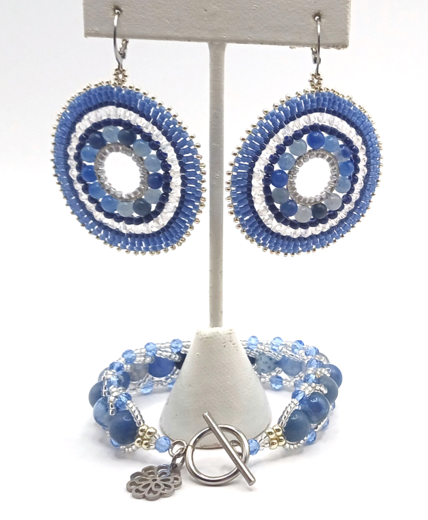 Hoop earrings & spiral stitched bracelet created w/ blue and silver seed beads, crystals and blue aventurine gemstones.